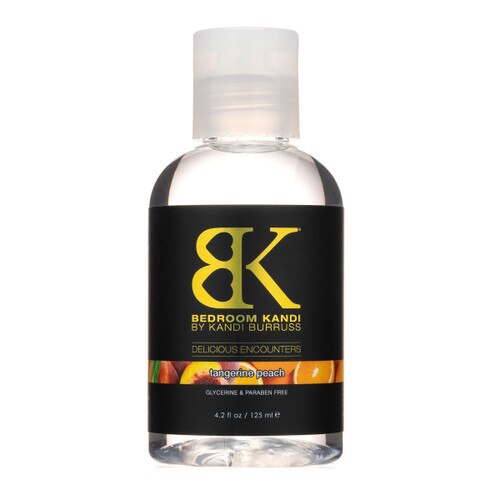 A clear bottle of our Delicious Encounters flavored sugar-free lubricant in Tangerine Peach flavor. The bottle sits on a white background.